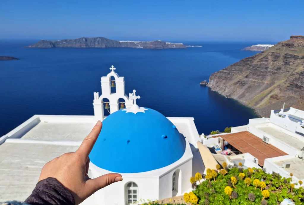 Quiet blue dome view in Santorini without the crowds and soft morning light
