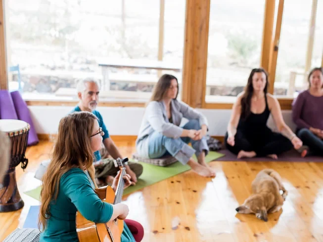 Cybele Holistic Space Santorini yoga and sound healing session in a calm, minimal indoor setting