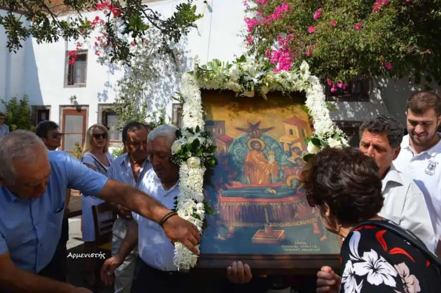august 15 in santorni - traditional greek icon kissing and worship